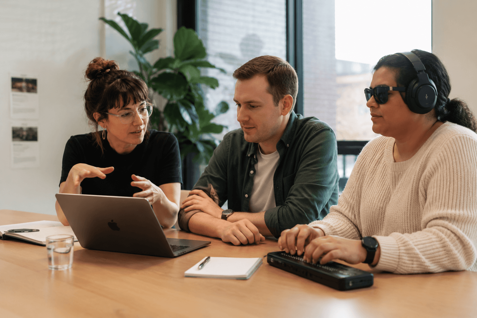 Accessibility consultant, client and screen reader user reviewing a website together in a collaborative workshop.